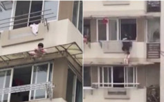 【片段】杭州3岁女爬窗危坐檐篷　男街坊徒手攀墙一拉救回