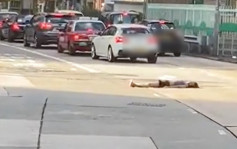 女子危躺荔枝角道馬路 車輛擦身而過險象環生