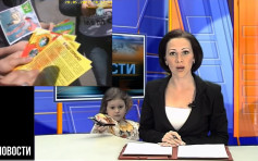 俄女主播报新闻遭4岁女儿闯入镜 窝心举动笑爆网民