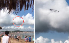 【有片】UFO？ 大连海滩上空惊现巨型黑烟圈