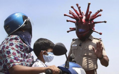 印度警戴「新冠病毒頭盔」 出奇招呼籲民眾留在家