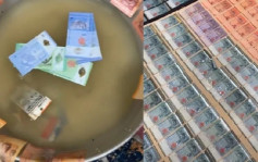 马国女网友分享洪灾后清洗钞票影片 满地现金景象壮观