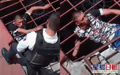 墨西哥小偷頭卡鐵欄受困 見警察即哀怨求援