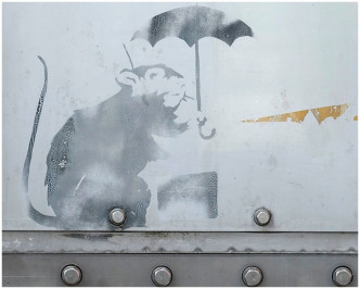 東京日前出現的塗鴉一樣是提著公事包撐傘的小老鼠。twitter