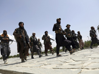 塔利班士兵在阿富汗喀布尔巡逻。AP
