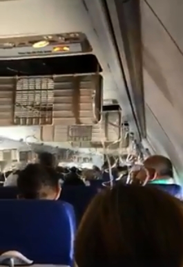 機艙顛簸乘客吸氧氣罩。影片截圖