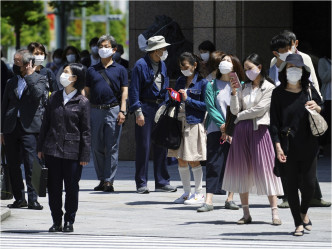 日本疫情严峻。AP