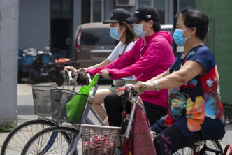 北京中高風險街鄉、新發地市場相關人員禁止出京。AP