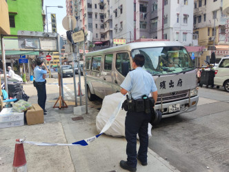 警方调查事件。 梁国峰摄