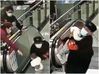 职员抱起男童，避免因摔下扶手电梯而造成严重伤害。网图