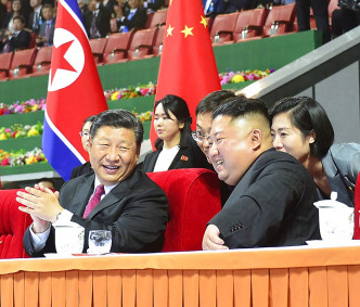 习近平与北韩领袖金正恩会面。AP图片