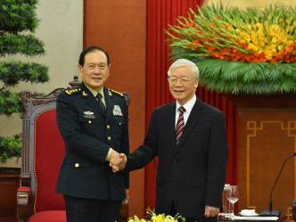 越共中央总书记阮富仲（右）。新华社图片