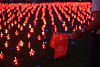 添馬公園燈光表演賀回歸及共產黨黨慶。