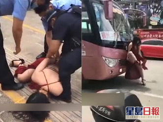 女子亦尝试拦其他车辆，及后被拘捕。网图