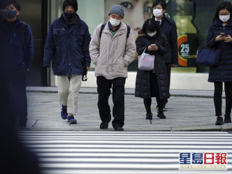 日本全國至今共錄得約41萬新冠肺炎確診個案。AP圖片