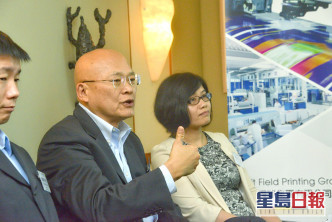 执行董事刘竹坚（左）。资料图片