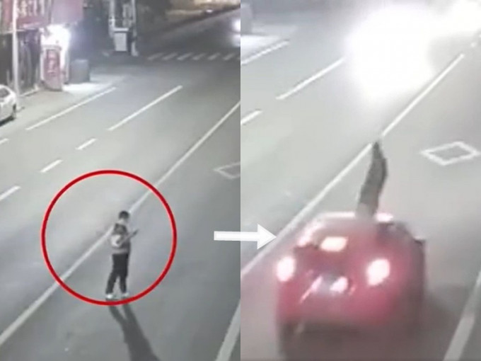 男子站在马路中间低头看手机，被车撞飞。影片截图