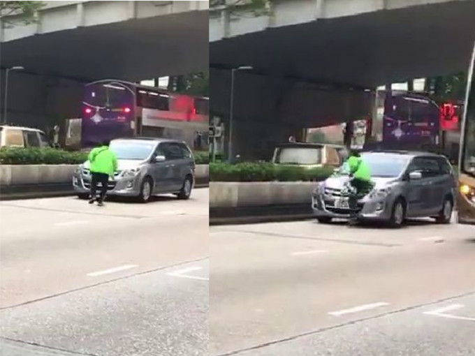 该绿衣人士见汽车停定后，仍「瞓身」飞撞车头。影片截图