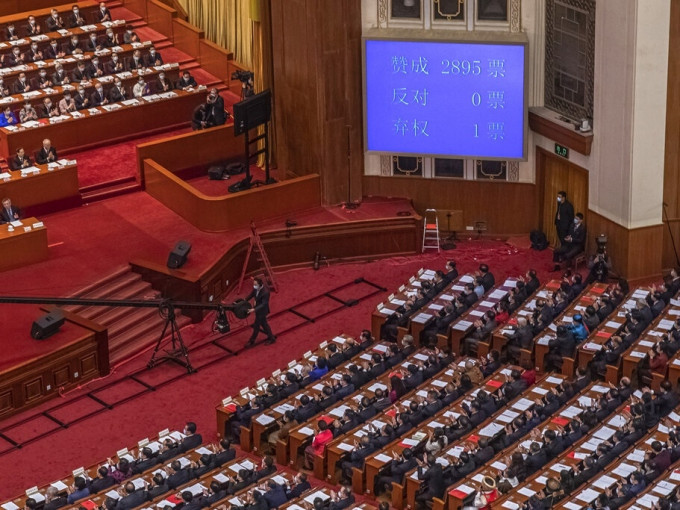 全国人大本月11日通过完善香港特别行政区选举制度的决定。AP图片