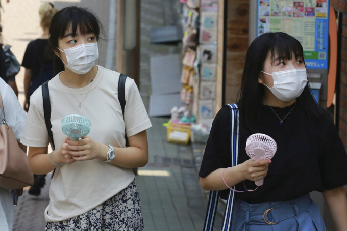 日本疫情持续回升。AP图片