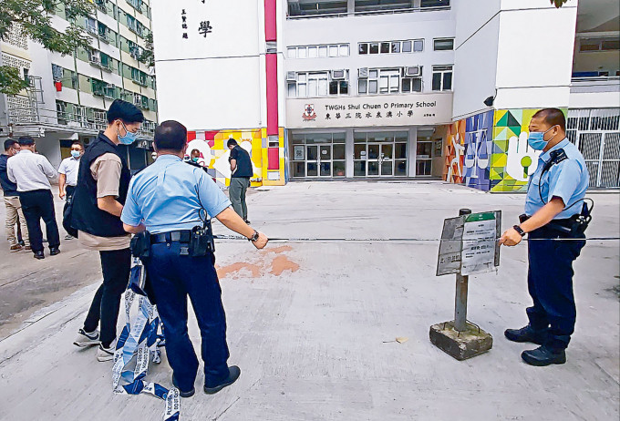 案發校門外現場遺下橙色漆油。資料圖片