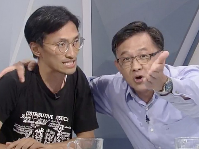 何君堯(右)指朱凱廸支持者破壞家墳。港台圖片