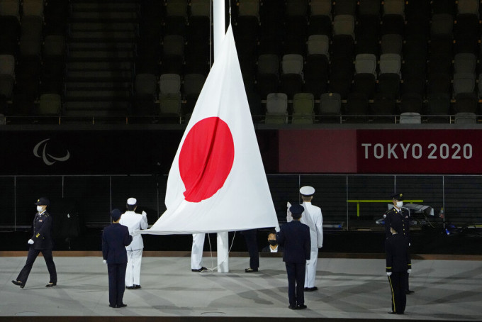 自衛隊在會場升起日本國旗。AP圖片