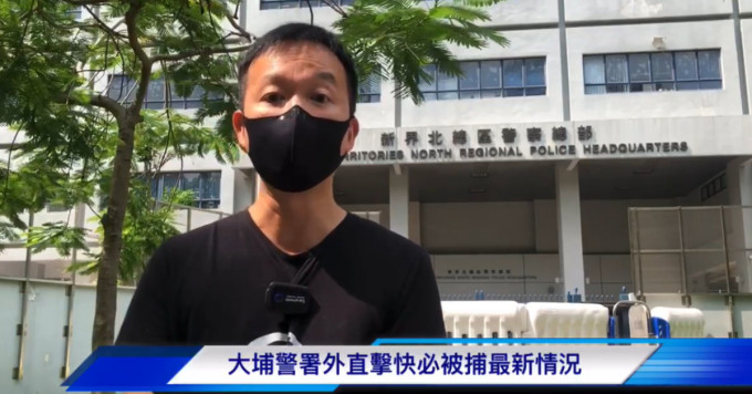 陈志全指谭得志在街站派发的口罩，涉嫌有违反国安法标语。
