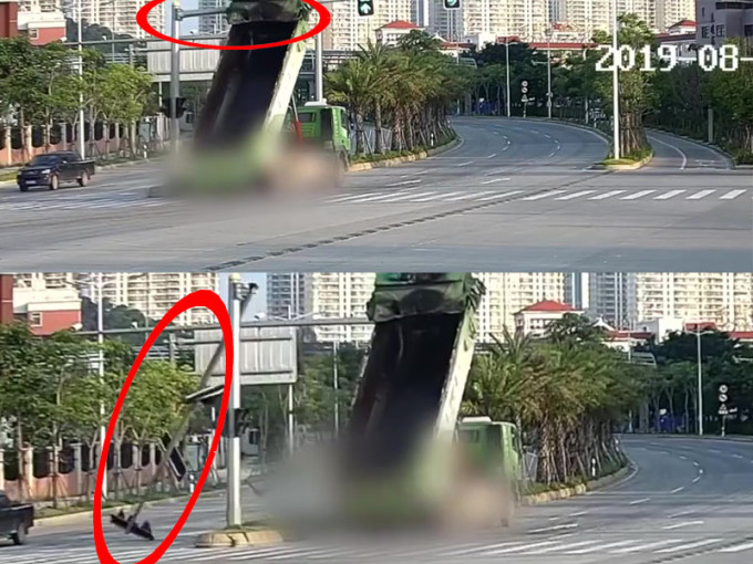 福建泉州一辆大货车忘收起车斗，直接撞断红绿灯。（网图）