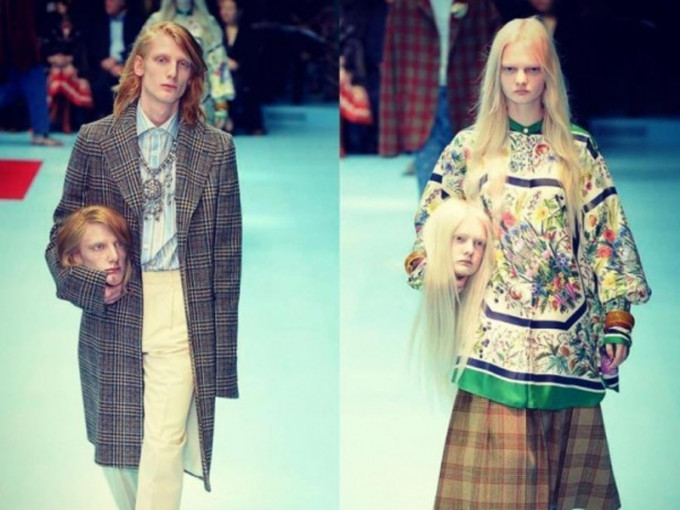 Gucci一男一女模特儿拿自己的「人头」行Catwalk，引发热话。（网图）