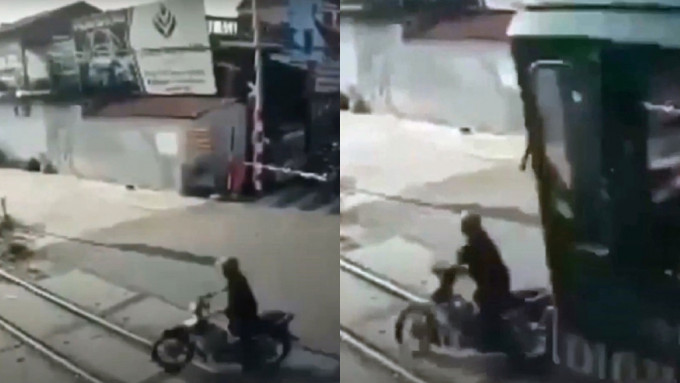 越南一名電單車司機強闖火車路軌被撞死。網上截圖