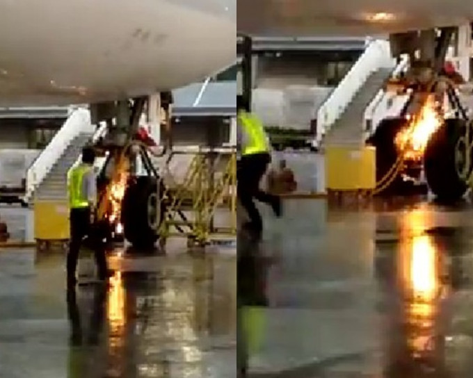 客機前轆狂爆火花，機場職員慌忙閃避。影片截圖