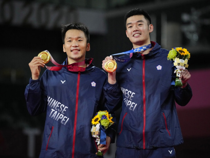 中華台北的王齊麟及李洋奪得奧運羽毛球男雙金牌。AP圖