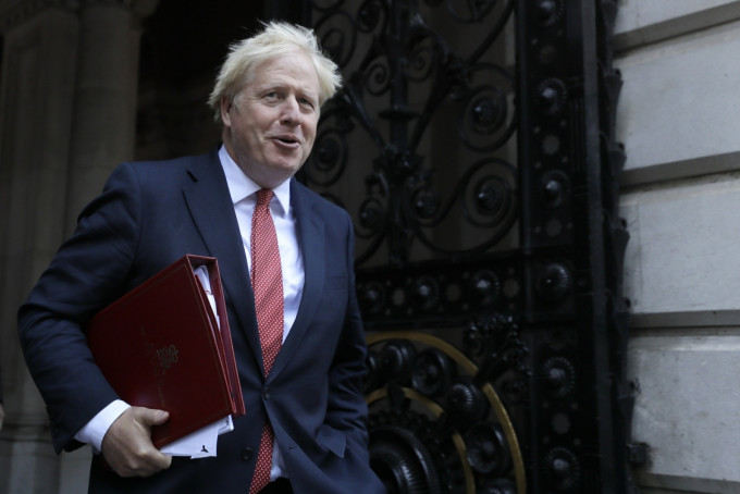 英国《泰晤士报》报道指英国首相约翰逊拟本月访美与拜登会晤。AP资料图片