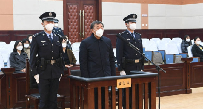 李文喜在法庭聽一審判決。