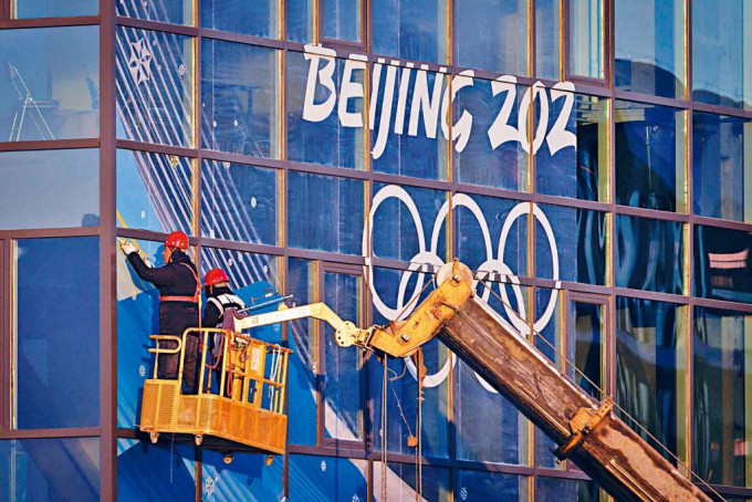 ■北京冬奧會場的工人。