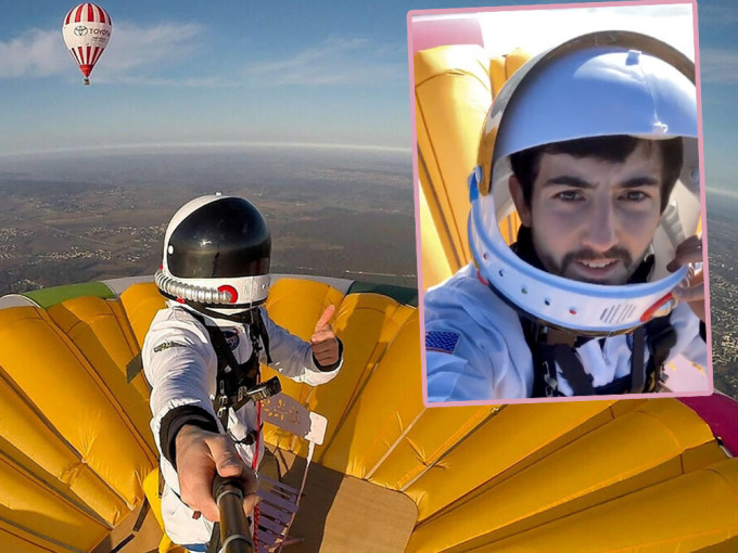 法國28歲男子烏弗拉德站熱氣球頂，升空3637米破世界紀錄。網圖/路透社圖片