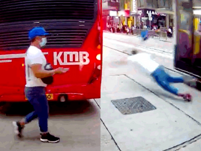 中环一名男子「楔车罅」过马路，遭巴士撞飞倒地。影片截图