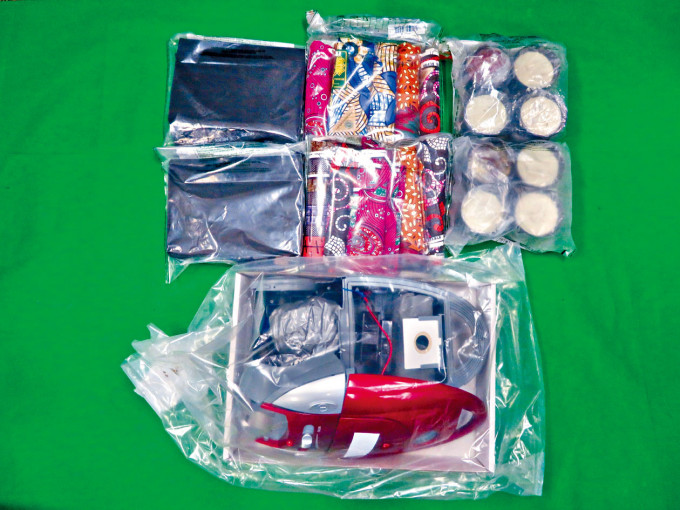 收藏毒品的物品包括吸尘机及蜡烛。