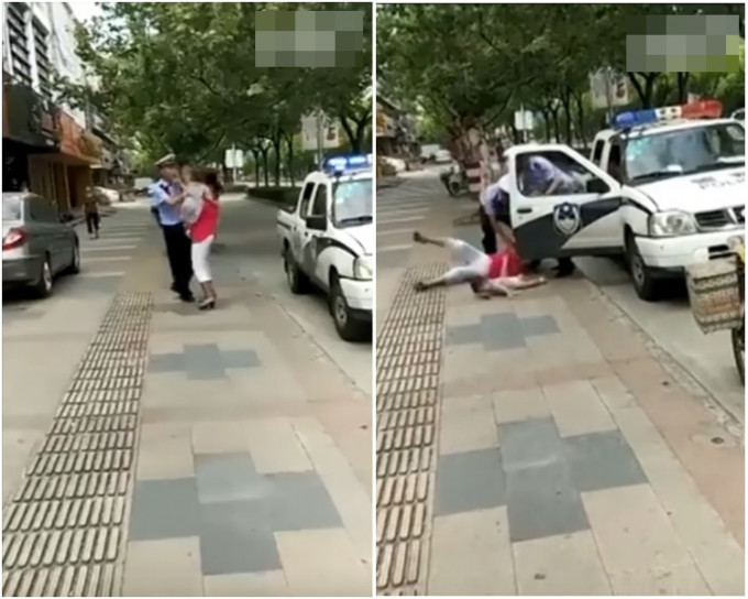 一名手抱幼童的女車主阻撓警方執法，民警用腳將其絆倒以制服。(影片截圖)