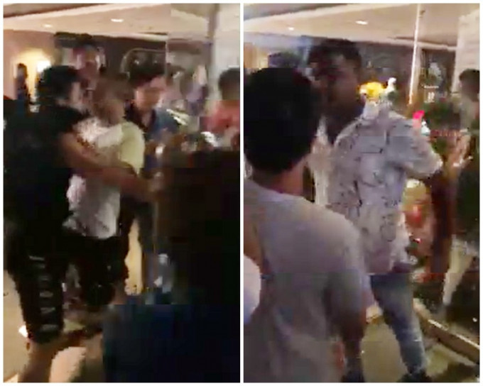 有男子强行冲入商场，另一名南亚人随即阻挡尾随市民进入。影片截图