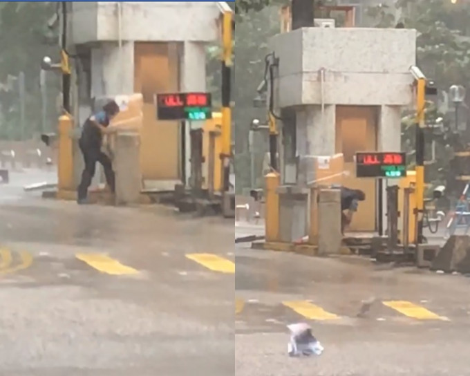 柴灣停車場職員堅守崗位，冒風雨清理斷裂車閘。影片截圖
