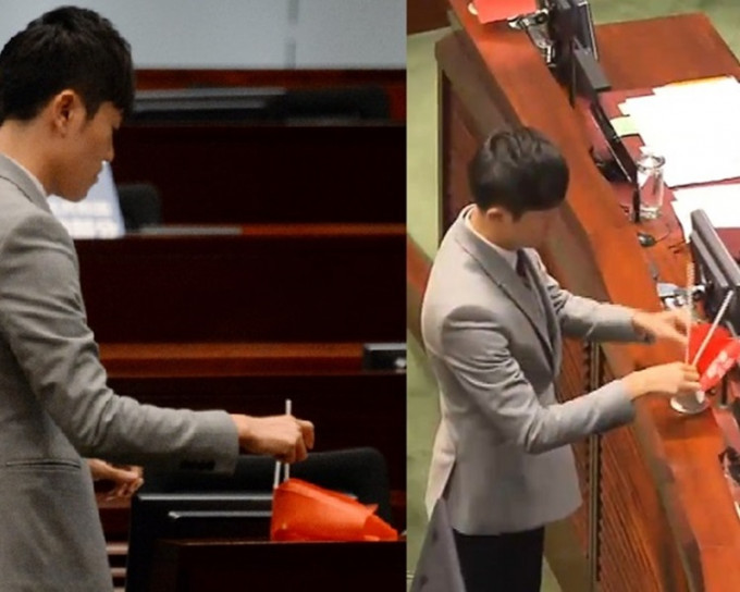 郑松泰涉于立法会倒转议员桌上的国旗及区旗。资料图片