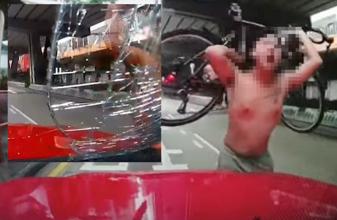 的士车头玻璃被单车男子用石头砸爆。网上片段截图