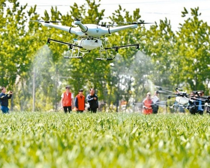 廣州舉行航空植保論壇，討論無人機噴灑農藥的技術問題。網圖