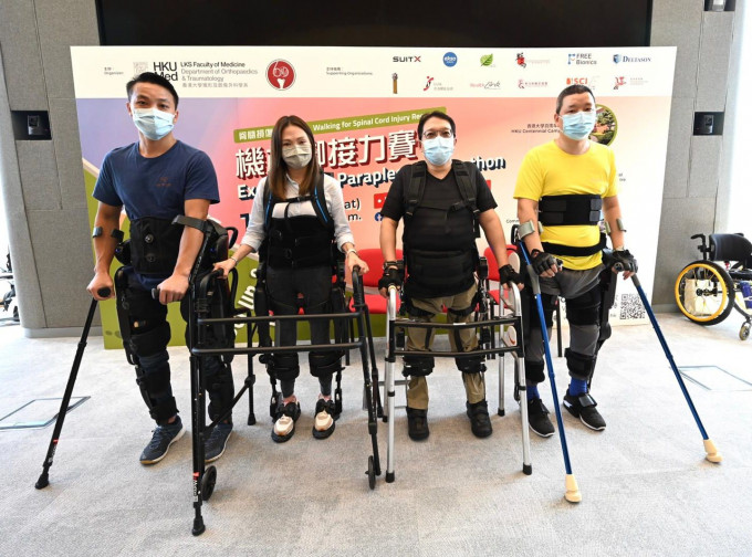4名脊髓损伤患者穿著机械脚，顺利完成赛事。