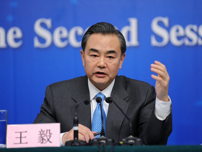 王毅說，中日韓三國面對疫情「守望相助、同舟共濟」。