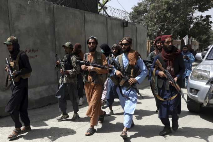 国际货币基金组暂停阿富汗金援。AP图