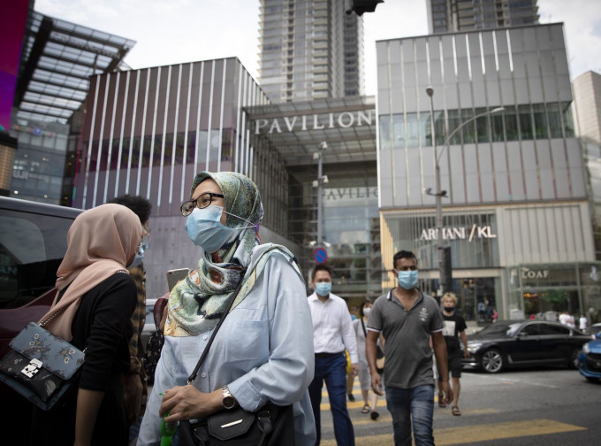 马来西亚疫情受控。AP