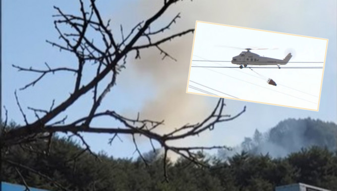 当局派出直升机协助救火。